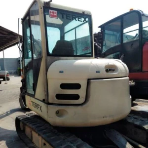 Miniexcavadora TEREX SCHAEFF HR 20 usada del 2004, 51 CV, 5.650 kg, con enganche rápido y cazo de 60 cm.