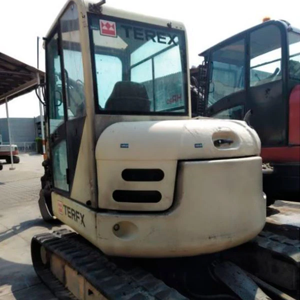 Miniexcavadora TEREX SCHAEFF HR 20 usada del 2004, 51 CV, 5.650 kg, con enganche rápido y cazo de 60 cm.