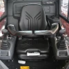 Vista interior de la cabina de la Eurocomach 19SK con mandos ergonómicos y joystick doble.
