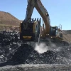 Cuchara Trituradora BF150.10 instalada en excavadora CAT trabajando sobre roca