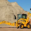 Venieri 1.33C en sitio de obra, mostrando su diseño compacto y brazo excavador trasero.
