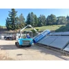 Messersi Roboklin 25 con brazo telescópico extendido y cepillo rotativo azul.