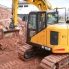 Excavadora SANY SY 155U en acción, destacando su giro reducido y gran estabilidad en obra.