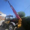 Telehandler SANY STH1440 maquina demostracion con pluma extendida totalmente y horquillas porta palet.