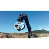 Pinza de Manipulación FURUKAWA FMP60-PL trabajando con excavadora en cantera, giro hidráulico y gran apertura para roca y RCD.