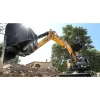 SANY SY26U realizando excavación en obra, miniexcavadora giratoria ágil con control proporcional y gran alcance de trabajo.